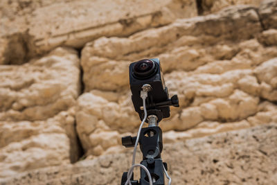 Close-up of camera on rock