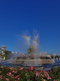 Fountain against blue sky