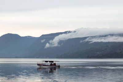 Scenic view of lake against mountain range