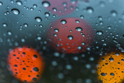 Close-up of raindrops on glass window