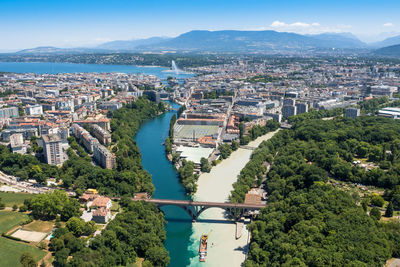 High angle view of buildings and trees against sky