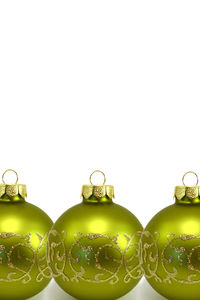 Close-up of christmas decorations over white background