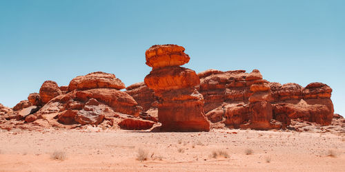 Rock formations in desert against clear sky