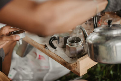 Close-up of hand holding coffee cup