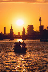 View of ship in sea at sunset