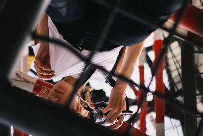 Close-up of man holding umbrella