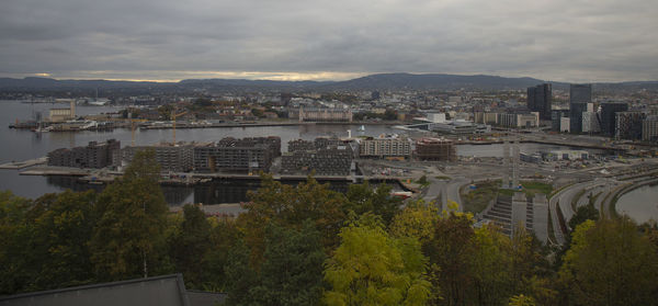 High angle view of buildings and trees against sky