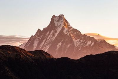 Scenic view of mountains against sky during sunset