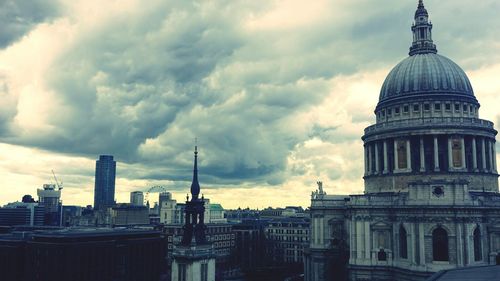 Low angle view of building against cloudy sky