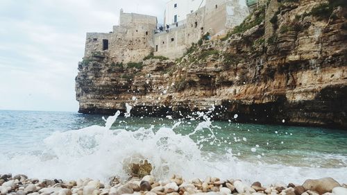 Sea waves splashing on rocks