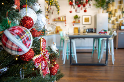 Christmas festive interior of kitchen and dining room decorated for the new year holiday, no people