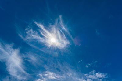 Low angle view of blue sky on sunny day