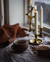 Close-up of candles on table