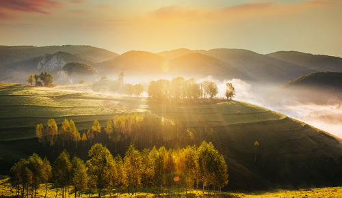 Scenic view of mountains against sky during sunset
