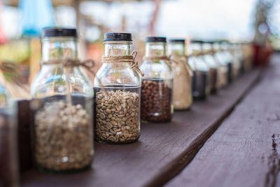 Rows of coffee in glass bottles concept of different types of coffee