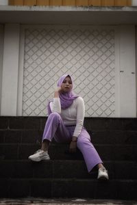 Portrait of woman sitting outdoors