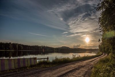 Dirt road by lake