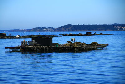 Scenic view of sea against blue sky