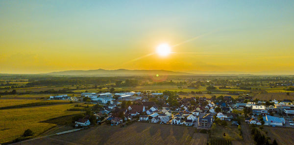 High angle view of townscape at sunset