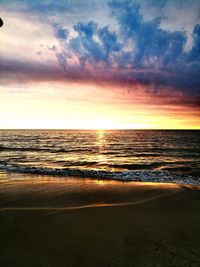 View of sea against cloudy sky during sunset