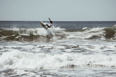 Man surfing in sea