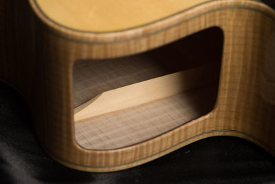 High angle view of guitar on table