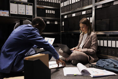 Young woman using laptop at office