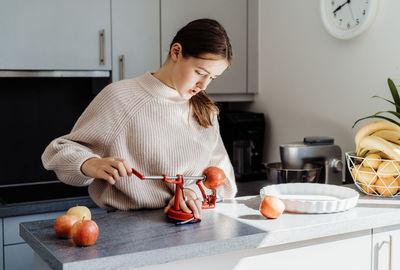 Cute girl preparing food at home