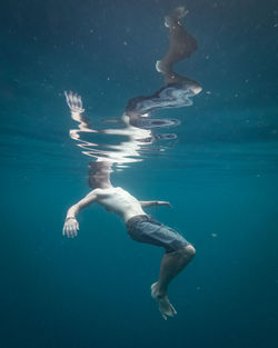 Man swimming in sea