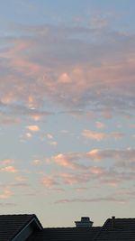 High section of building against cloudy sky