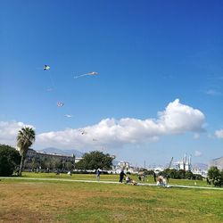 People against blue sky