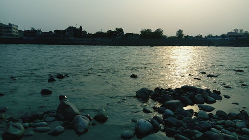 Scenic view of lake against sky during sunset