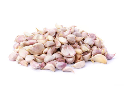 Close-up of roasted coffee beans against white background