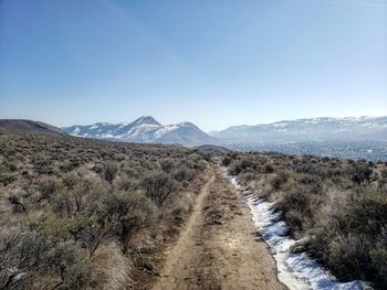 Scenic view of mountains against clear blue sky