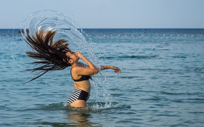 Woman enjoying in sea