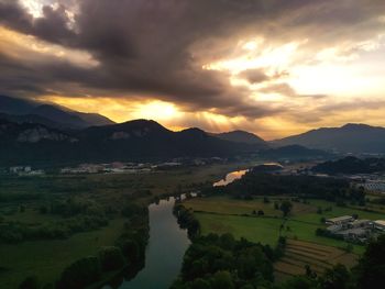 Scenic view of lake against sky during sunset