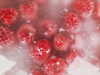 Full frame shot of frozen raspberries