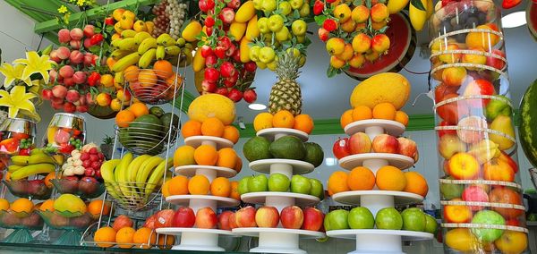 Multi colored fruits for sale at market stall
