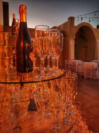 Glass of wine bottles on table