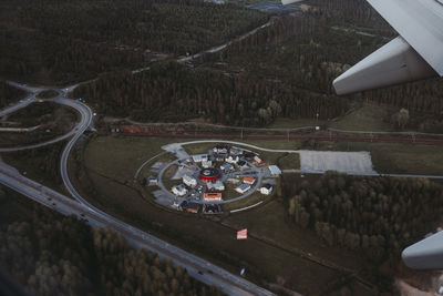 High angle view of airplane flying over landscape