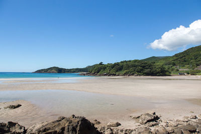 Scenic view of sea against blue sky