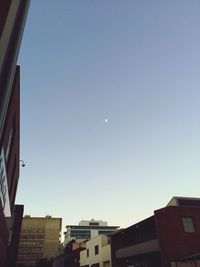 Low angle view of buildings against clear sky