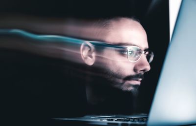 Close-up portrait of man using smart phone