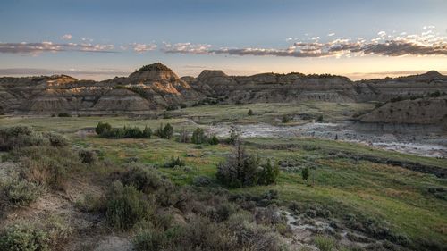 Scenic view of landscape against sky during sunset