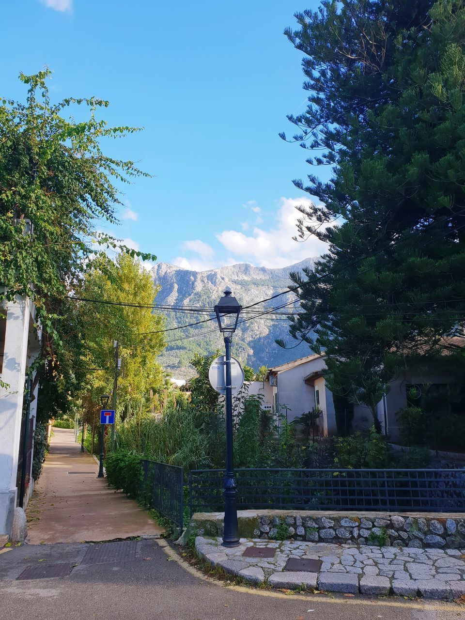 FOOTPATH BY STREET AGAINST SKY