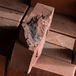 High angle view of rusty machine on wood