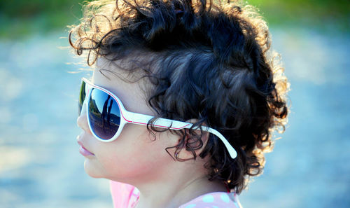 Close-up of girl wearing sunglasses