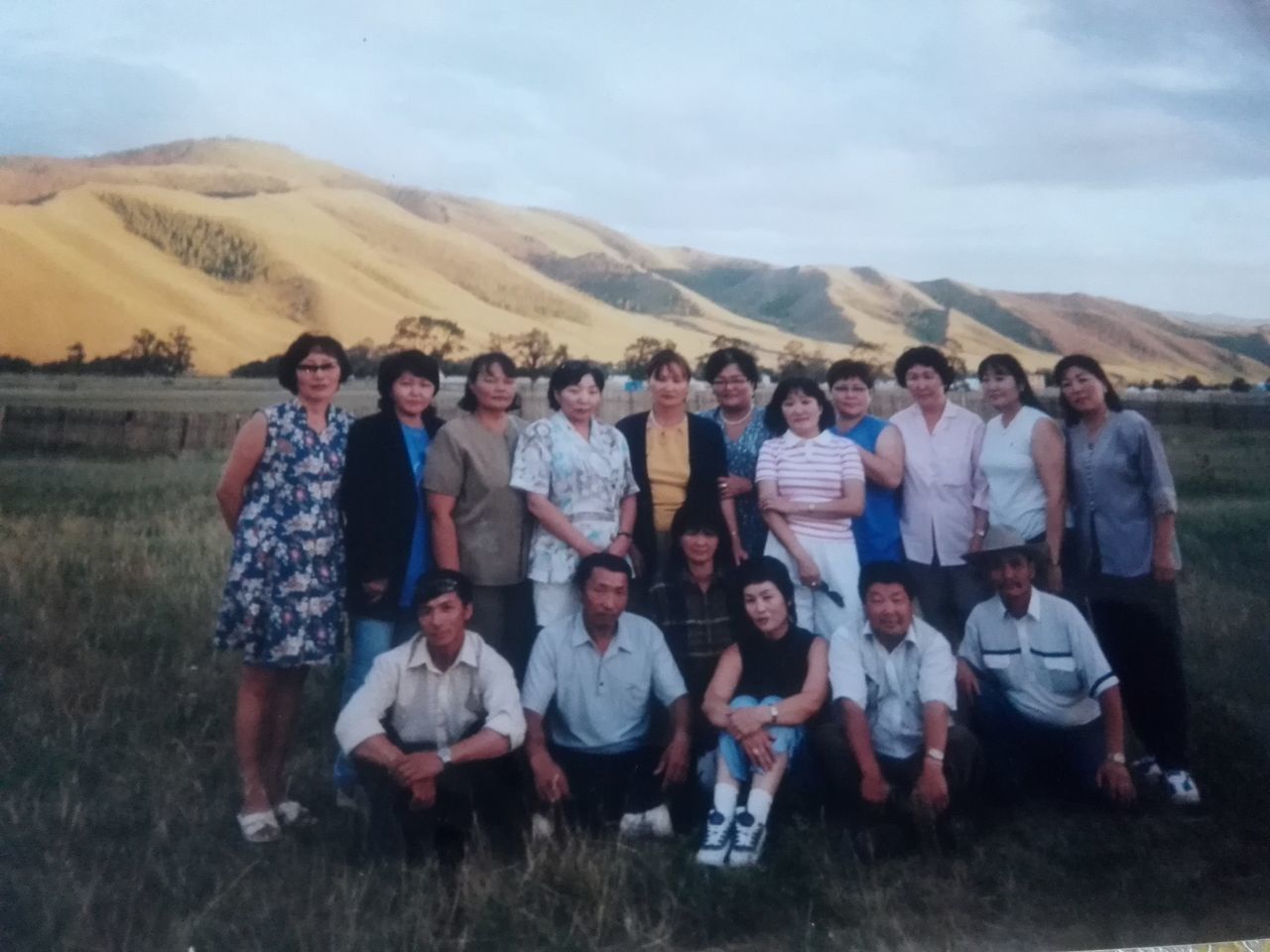 group of people, real people, women, adult, mountain, men, full length, sky, togetherness, nature, people, day, standing, environment, lifestyles, casual clothing, smiling, young men, looking at camera, land, outdoors, mature men