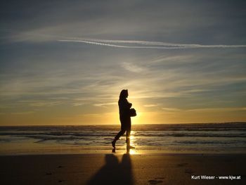 Scenic view of sea at sunset