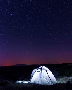 Tent against sky at night